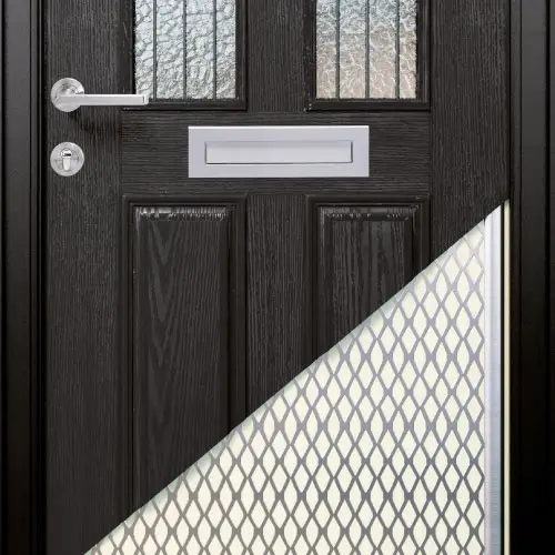 A modern black front door featuring vertical decorative glass panels with a frosted pattern, a sleek silver handle, and a matching silver letterbox. The lower section includes diamond-patterned textured glass for additional privacy.